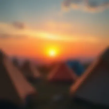 A picturesque view of tents set against a beautiful sunset