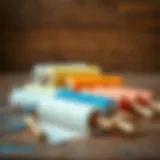A variety of paint rollers resting on a wooden surface