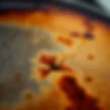 A close-up of a burnt pot surface with visible stains